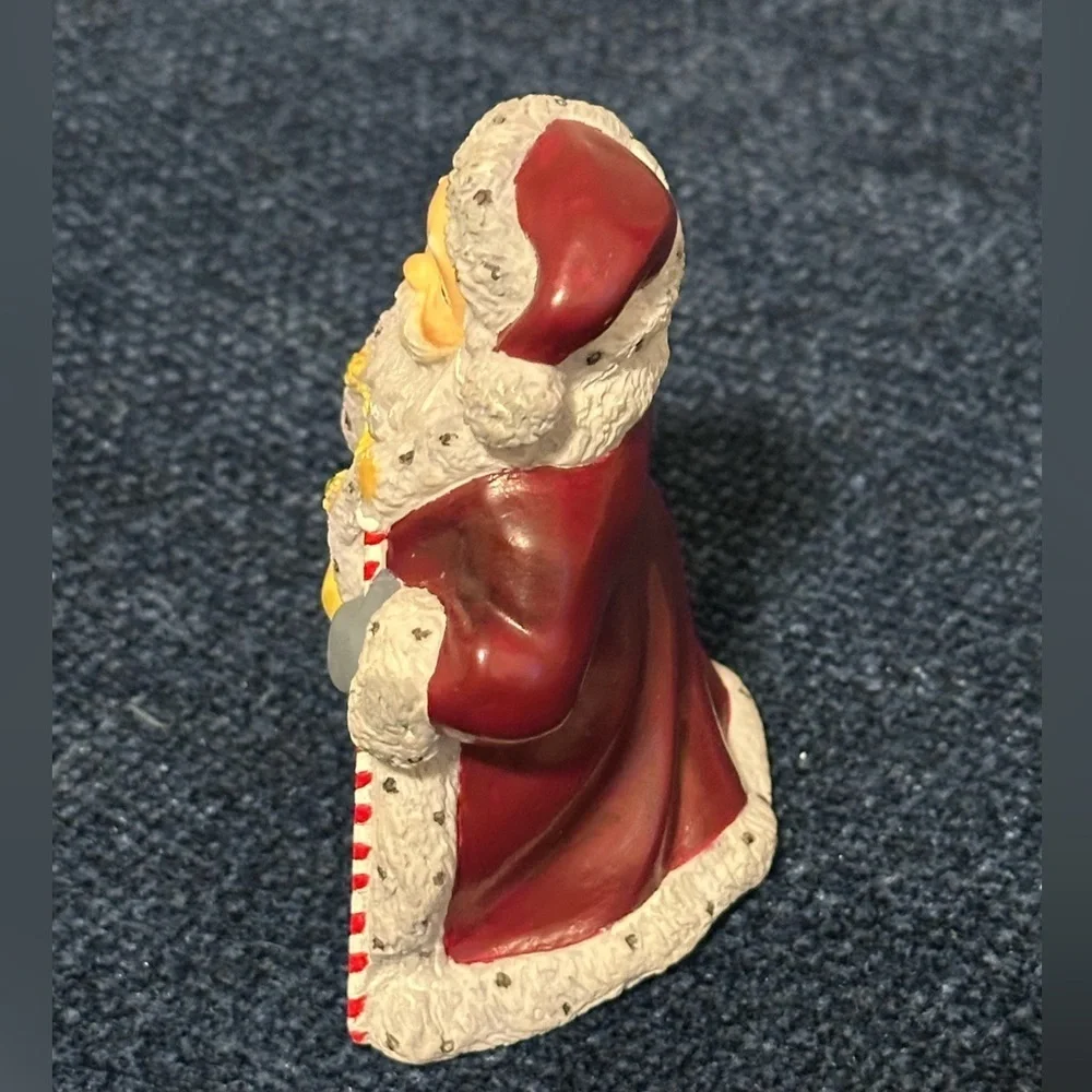 Small Santa with stars on his robe by Lenox’s Collectors Treasury of Santa’s.